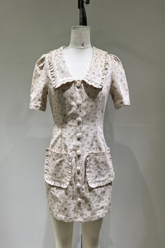 Light pink floral short dress with ruffled collar and pockets, perfect for casual outings.