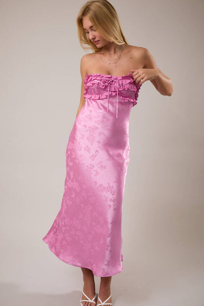 Strapless pink satin dress with ruffled neckline and floral pattern, perfect for summer events.