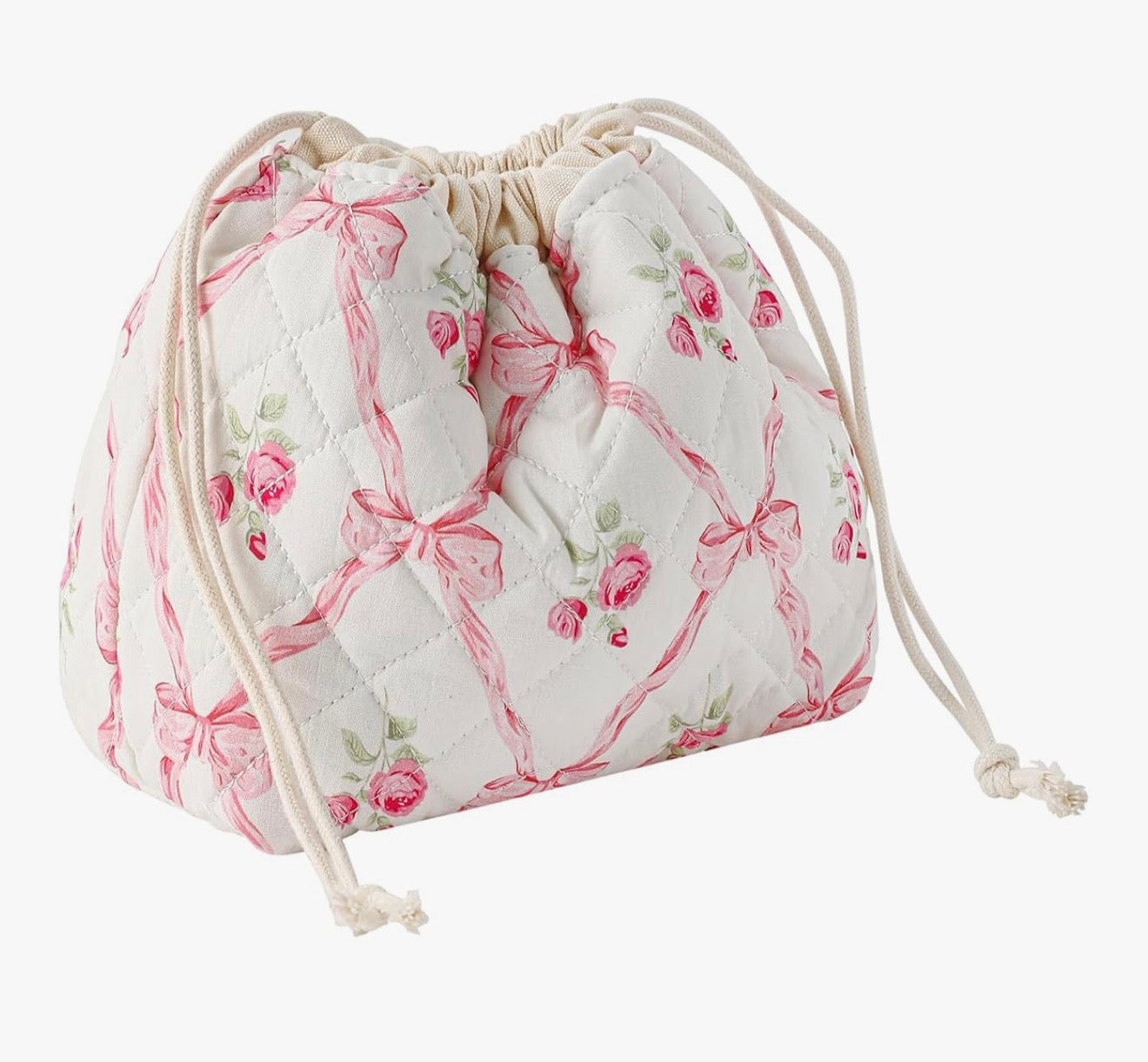 Quilted drawstring bag in white with pink roses and bows, perfect for stylish storage.