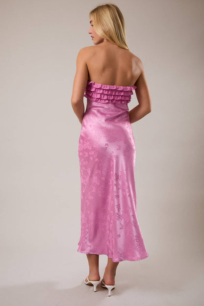 Elegant pink satin midi dress with ruffled neckline and floral pattern, perfect for special occasions.